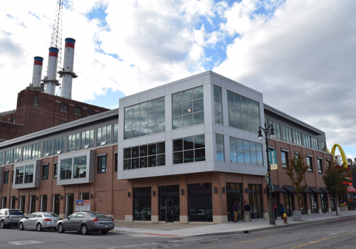 Mixed-use building with McDonalds sign in the background