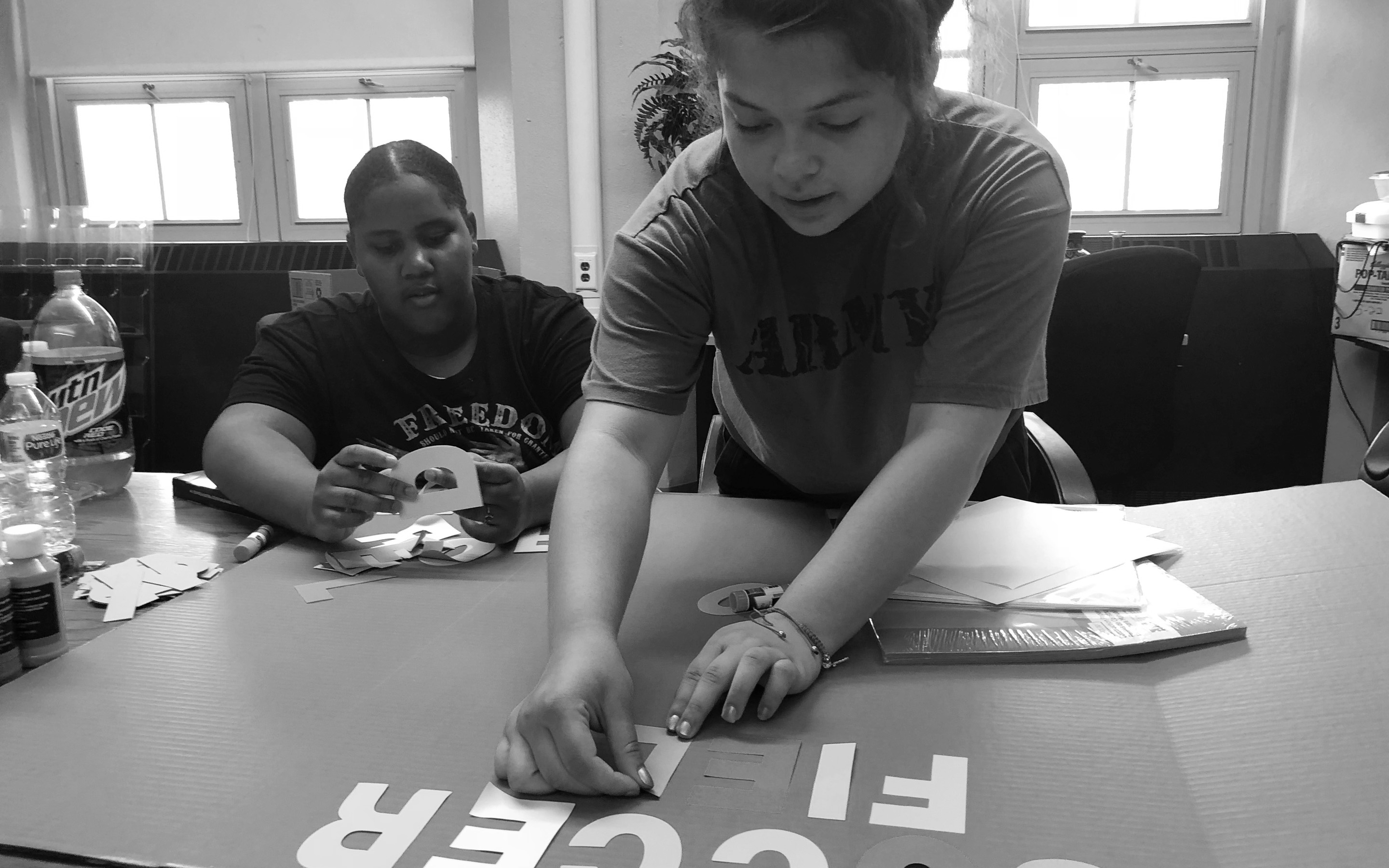 Two people making crafts