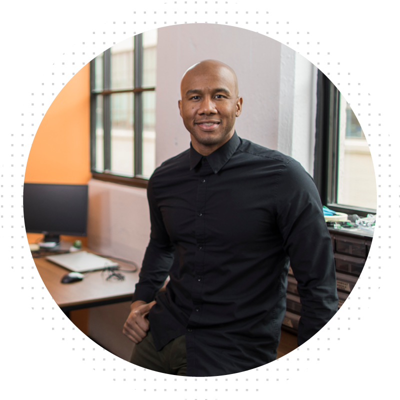 Man smiling at camera from office
